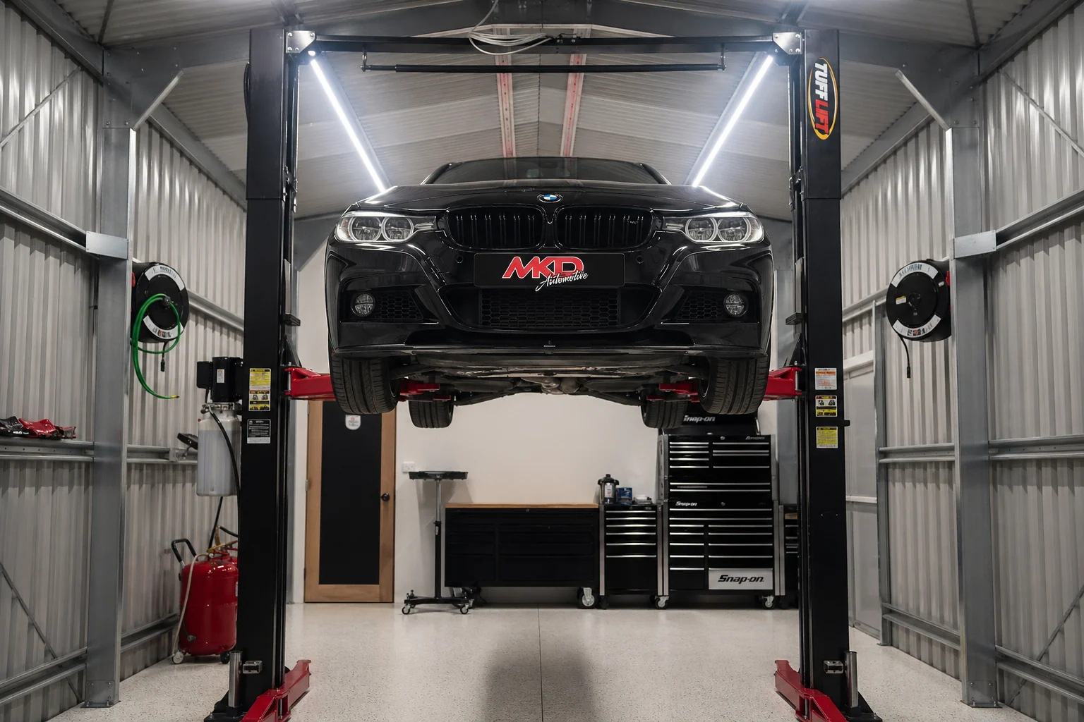 MKD Automotive BMW on workshop hoist